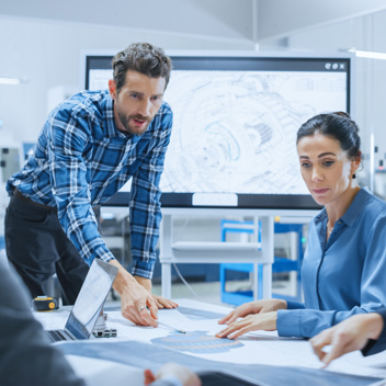 Engineer Team planning a project in a lab.