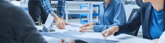 Engineer Team planning a project in a lab.